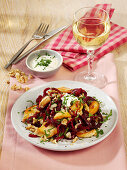 Salad with beetroot noodles, chicken breast and goat cheese
