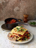 Layered pasta with puttanesca sauce