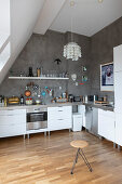 Open-plan kitchen in high-ceilinged interior