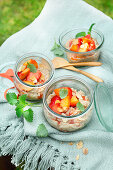 Vegan risotto substitute with almond drink, strawberries and peaches