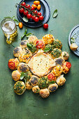 Bread roll wreath with a cheese dip