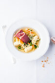 Semolina dumplings in beef bouillon with Flädle (pancake strips) and cured beef boiled fillet