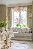 Fitted window seat with cushions in kitchen-dining room