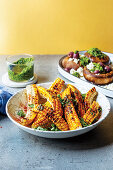 Grilled corn sliced from the cob and mushrooms with chermoula