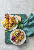 BBQ-basted cauliflower kebabs on pitas with two sides