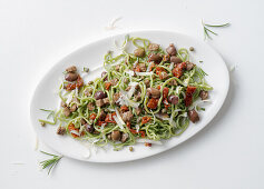 Green tagliolini with sautéed beef, capers, and olives