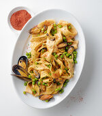 Pappardelle with mussels, and peas, and dusted with paprika