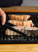 Fresh salmon and asparagus being grilled