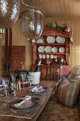 Festive table, chandelier and sideboard in cabin dining room