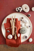 Flotsam and jetsam table decoration made from stones and branches