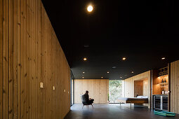 Central room with bedstead and kitchenette in a Pavilion House