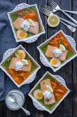 Salmon jelly with peas, carrots and egg