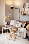 Living room in earth tones with cosy sofa and cushions