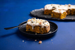 Pumpkin pie with vegan cream cheese topping, caramelised pumpkin and walnut seeds