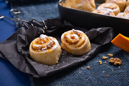 Vegan yeast buns filled with pumpkin pudding and walnuts