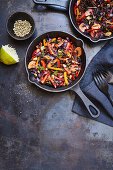 Vegetable paella with wild rice and pine nuts