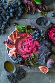 Beetroot hummus with figs and grapes