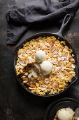 Apple crumble served with ice cream