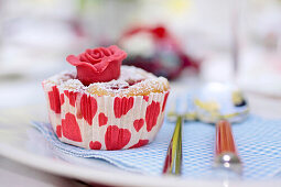 Cherry muffin with red marzipan rose