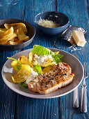 Potato chips with spinach and pork chops