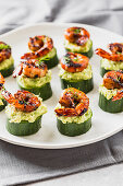 Cucumber rounds, smashed avocado, glazed prawn topped with fresh dill herbs