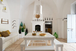 Mediterranean kitchen with dining area and brick fireplace