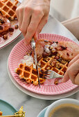 Waffles for breakfast with home-made jam and nuts
