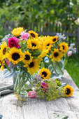 Sunflower bouquet with roses, borage and fennel flowers