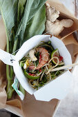 Fried noodles de luxe in a take-away box