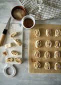 Preparing puff pastry tubes with cinnamon
