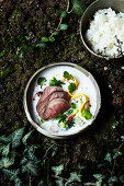 Leg of venison in tom kha broth with green vegetables and jasmine rice