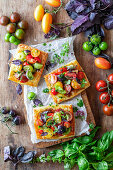 Tomato puff pastries with cheese and marinated tomatoes