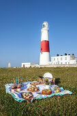 Picnic in front of Portland Bill Lighthouse, Isle of Portland, Dorset, England