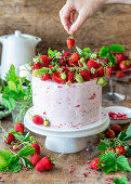 Strawberry buttercream cake with baked strawberry cheesecake layer