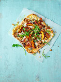 Blue cheese and pancetta BBQ pizza with grilled peaches