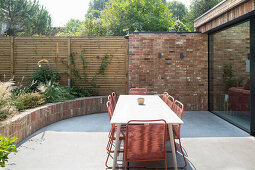 Table and chairs on sunny terrace