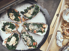 Oysters Rockefeller (Oysters au gratin with spinach, USA), ready to cook