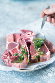Spread fresh lamb chops with peppermint oil marinade