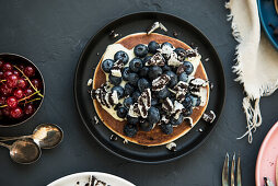 Pancakes with chocolate biscuits and blueberries