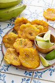 Plantain tostones, fried in canola oil with flaky salt on top