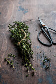 Fresh thyme with a pair of herb scissors