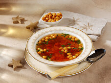 Clear soup with fried batter pearls made with Madeira for Christmas