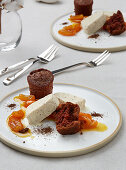 Warm chocolate cake with a kumquat ragout and a cinnamon blossom parfait