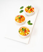 Couscous with summer vegetables served in small bowls