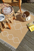 Seagrass rug decorated with diamond pattern on terrace