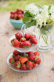 Tiered dessert stand with fresh strawberries