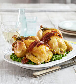 Stuffed spring chickens with peas