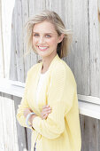 Young blonde woman in yellow cardigan