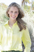 Boy, blonde woman in yellow blouse
