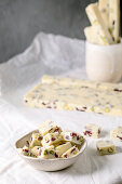 Homemade white chocolate candy bar with pistachios nuts and cranberries